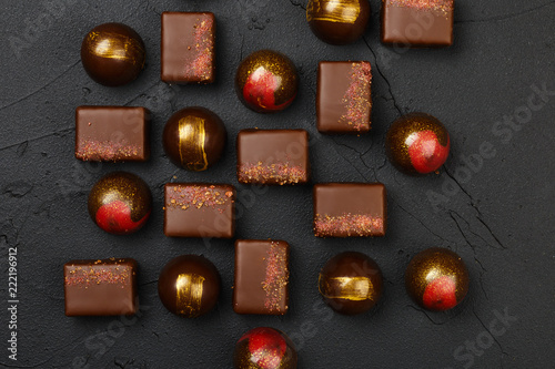 Set of luxury handmade bonbons on black background