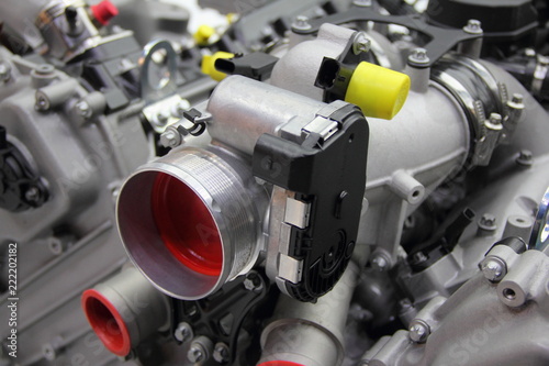 Foto Model of new car V12 engine - throttle pipe with throttle position sensor and ma