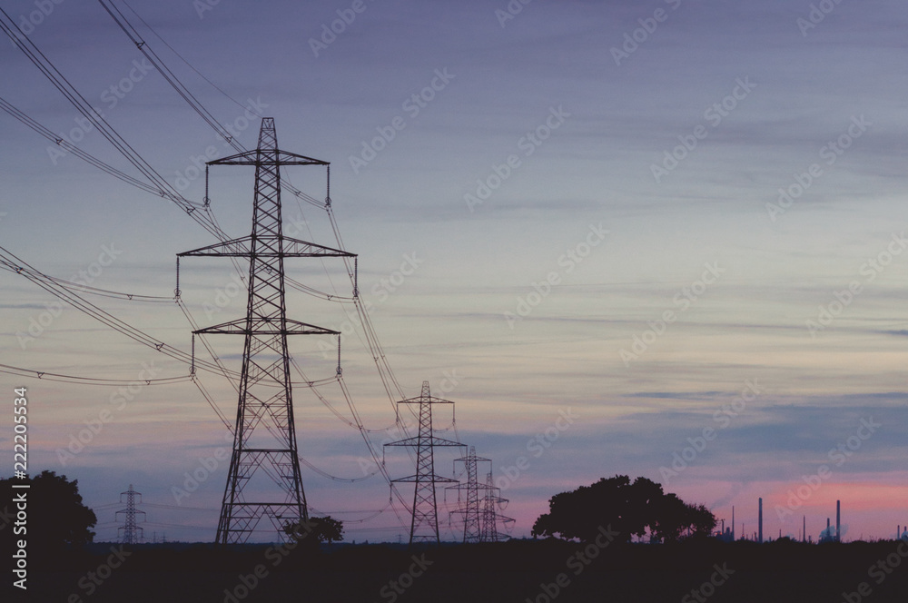 Electricity pylons at sunset