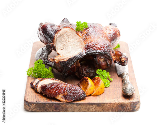 Roasted  duck with orange sauce isolated on white