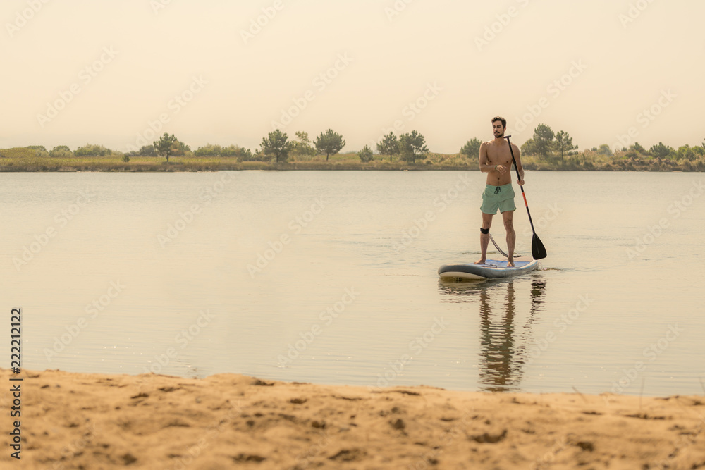Man stand up paddleboarding