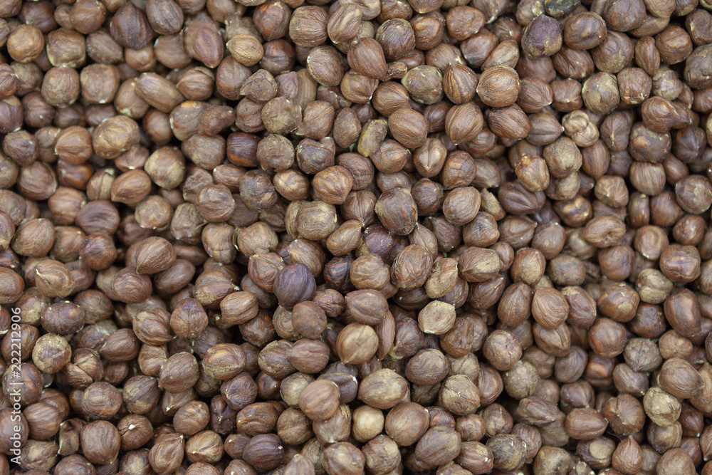 Purified hazelnuts on market counter in daylight. Purified hazelnuts on market counter in daylight.