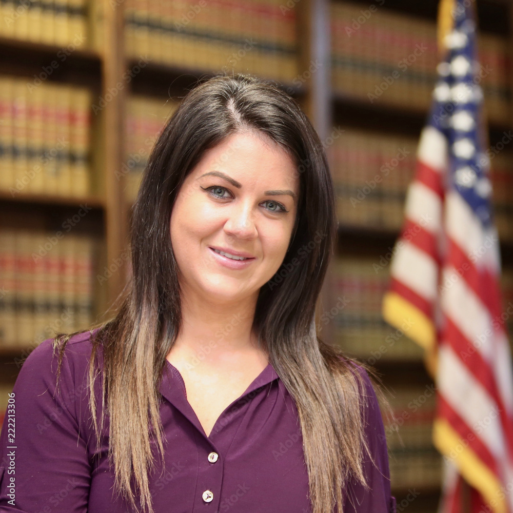 Young attractive woman attorney in law library