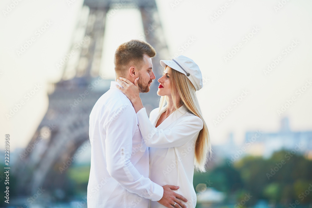 Romantic couple having a date near the Eiffel tower Romantic couple having a date near the Eiffel tower