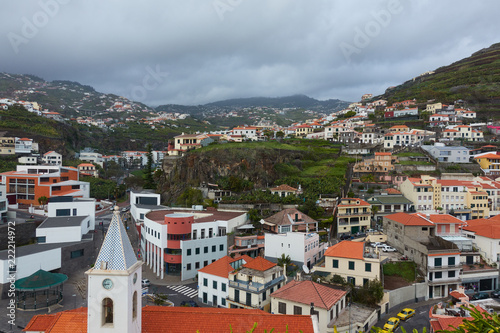 View of São Sebastião church with Cape Girão, in Câmara de Lobos, Madeira