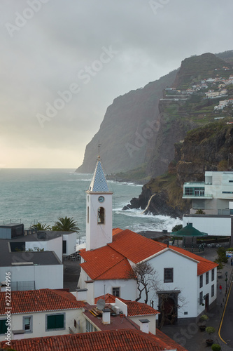 View of São Sebastião church with Cape Girão, in Câmara de Lobos, Madeira photo