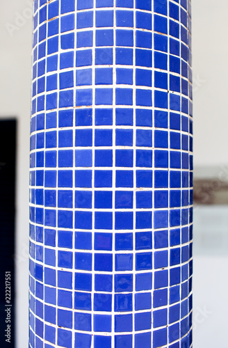 Blue mosaic tiles on a a pillar