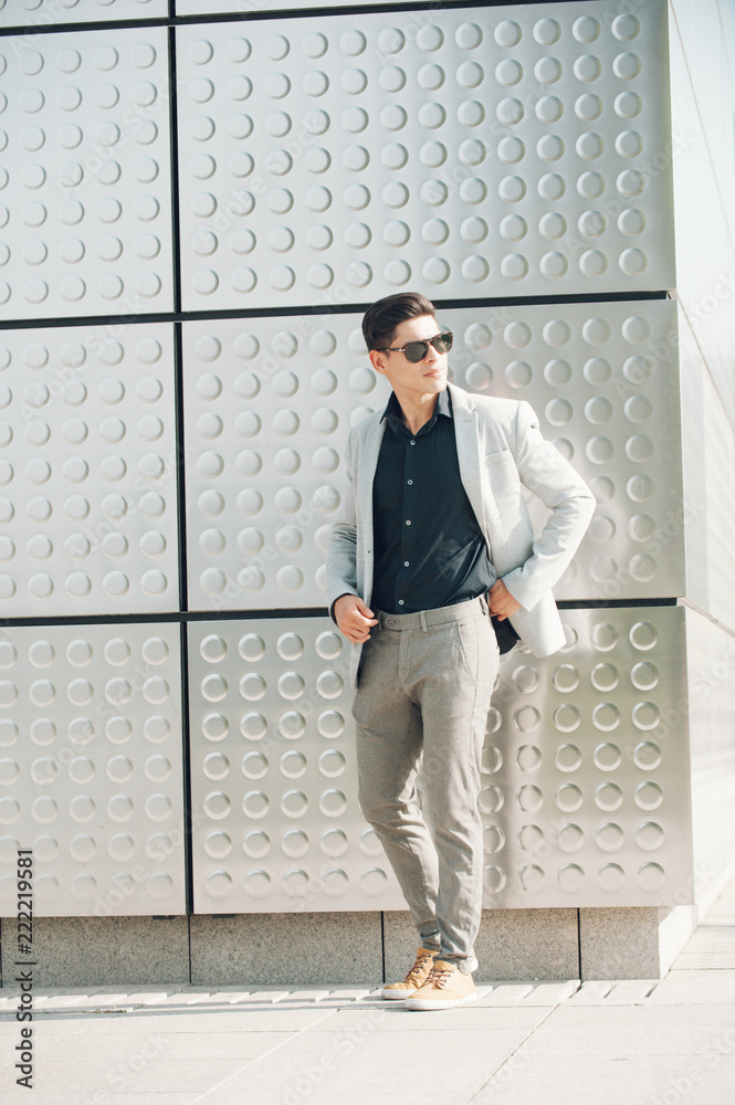 Confident man standing near building Confident man standing near building