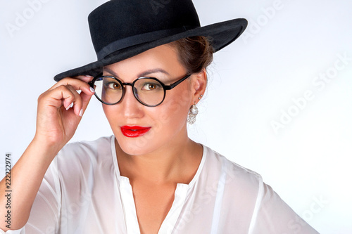 Asian woman with glasses. A...