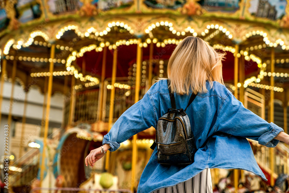 portrait of a girl in American style on a swing laughs and rejoices portrait of a girl in American style on a swing laughs and rejoices