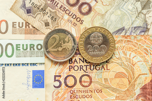 euro notes and coins and Portuguese escudo photo