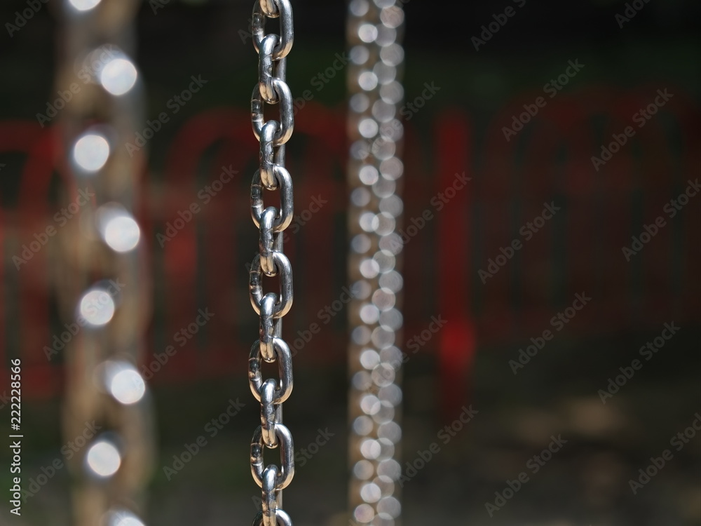 Vertical shiny chrome chain and circles Vertical shiny chrome chain and circles