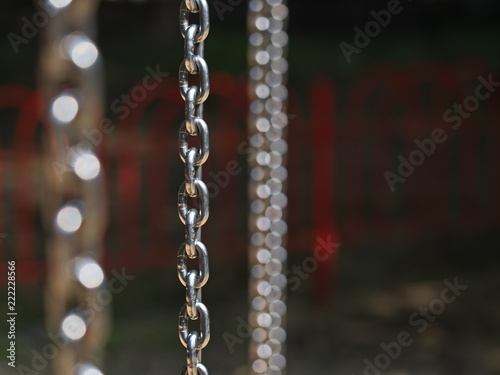 Vertical shiny chrome chain and circles