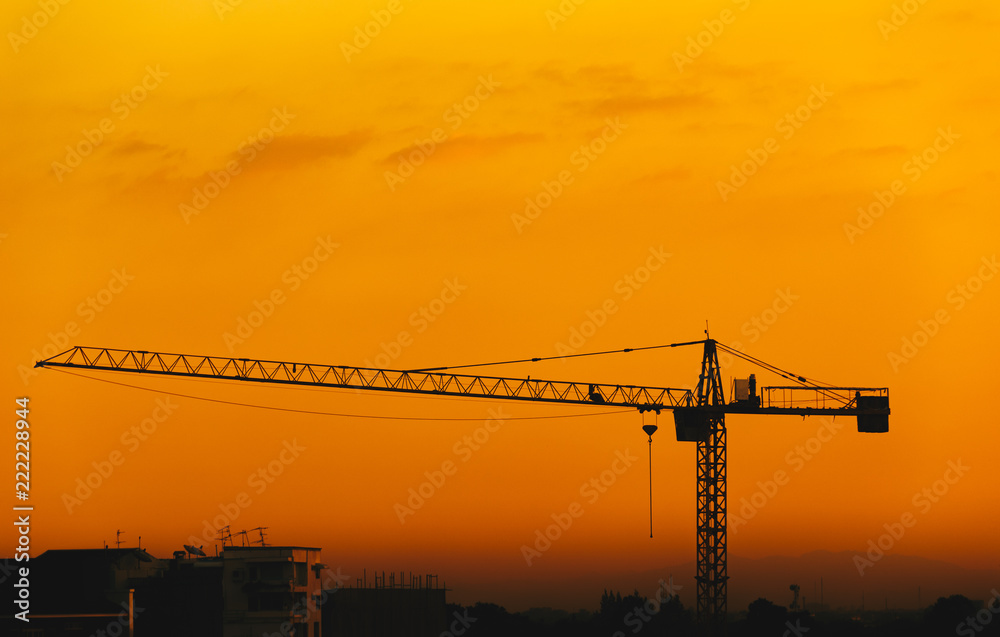 silhouettes Construction cranes and buildings