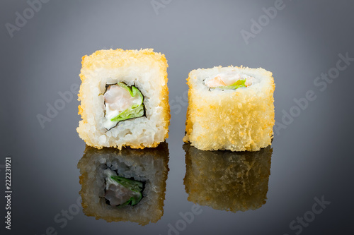 Hot roll with shrimp on black with reflection