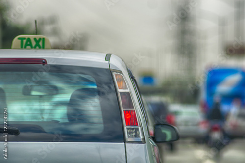 silver taxi on the move photo