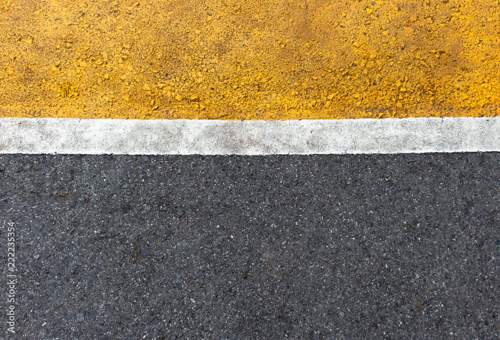 Fototapeta premium Background of yellow black strips . Dark grey asphalt road divided by yellow paint. yellow black background. using for book cover or your design..