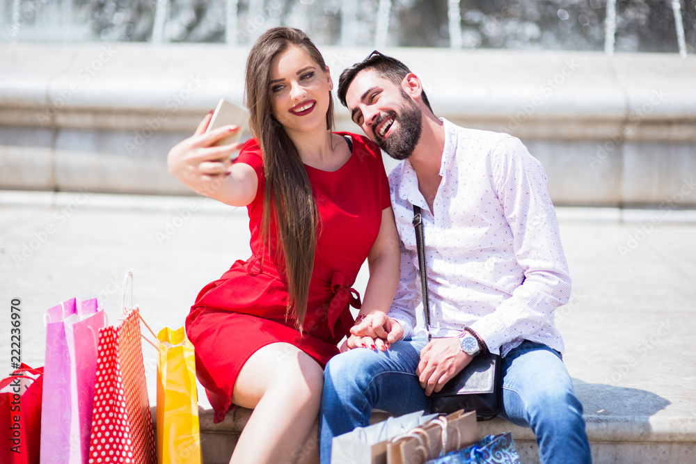 Young Man And Woman Taking Selfie On Mobile Phone Young Man And Woman Taking Selfie On Mobile Phone