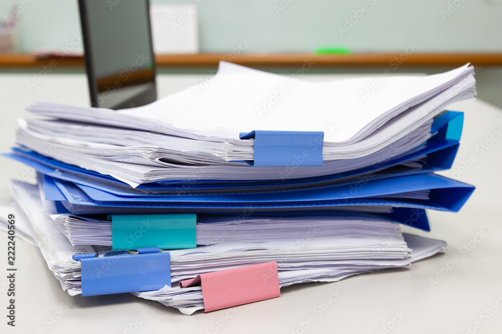 file folder and Stack of business report paper file on the table in a work office, concept document in work office file folder and Stack of business report paper file on the table in a work office, concept document in work office