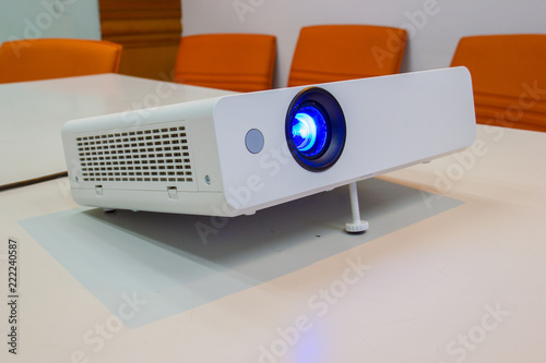 projector for presentation in a meeting room (Light in a light yellow tone room.)