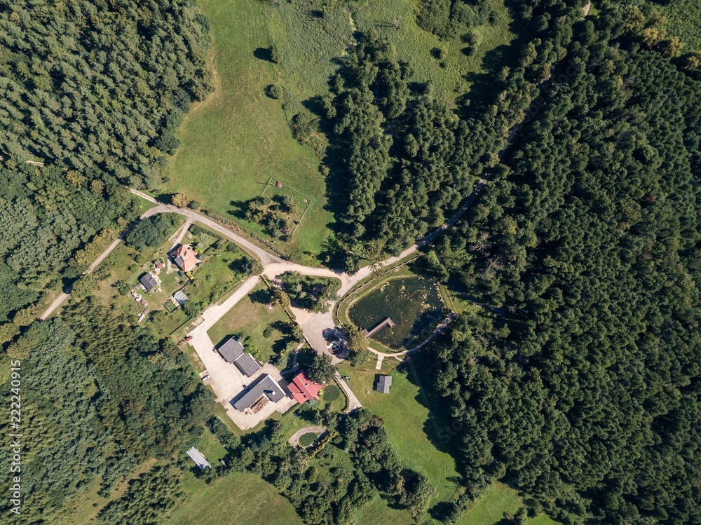 Forest and buildings seen from above.  Beautiful drone landscape.