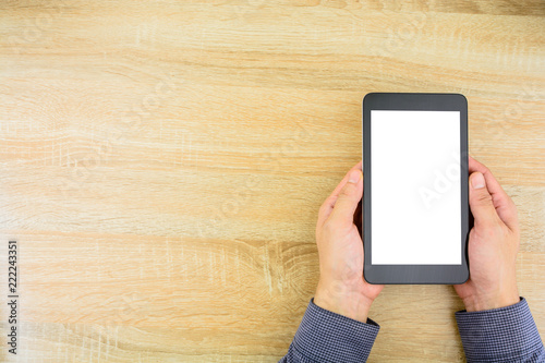 Businessman holding digital tablet with blank screen.Copy space for text.