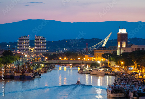 Pescara (Italy) - The view in the dusk from Ponte del Mare monumental bridge in the canal and port of Pescara city, Abruzzo region. photo