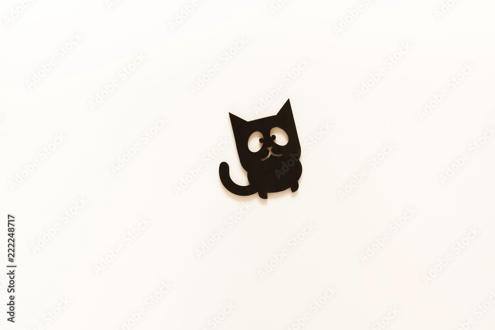 Halloween background. black cat decoration toy on white background. copy space. Halloween background. black cat decoration toy on white background. copy space.