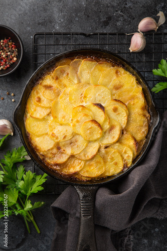 potato gratin in cast iron pan photo