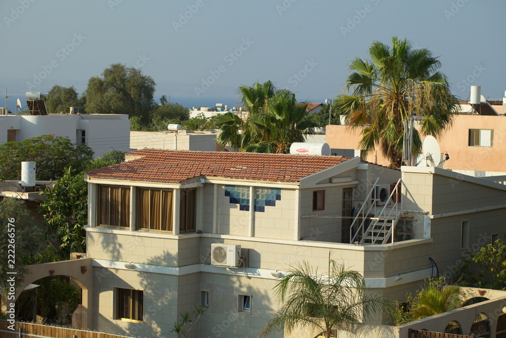 Fototapeta premium View of the sea and mountains from the residential area with the houses of the city of Eilat in Israel