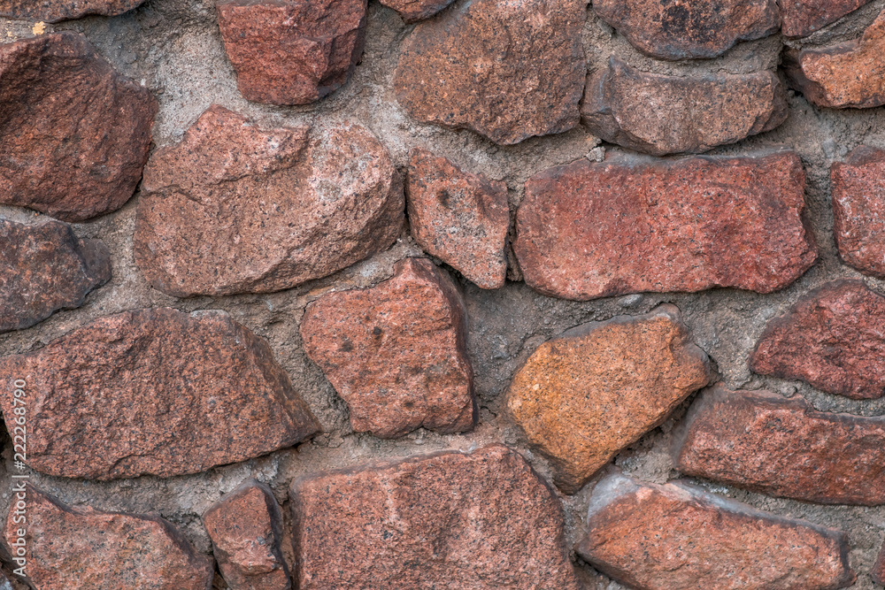 Red stone wall background Red stone wall background