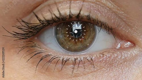 Brown eye girl with futuristic software interface.