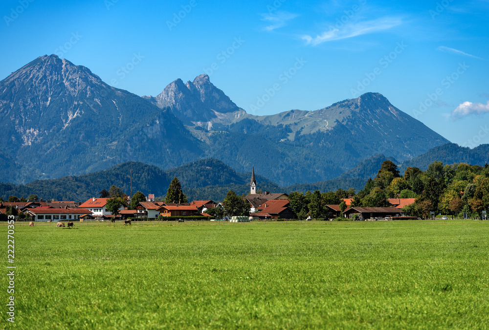 Countryside Landscape with Alps and the village of Schwangau - Bavaria Germany Countryside Landscape with Alps and the village of Schwangau - Bavaria Germany