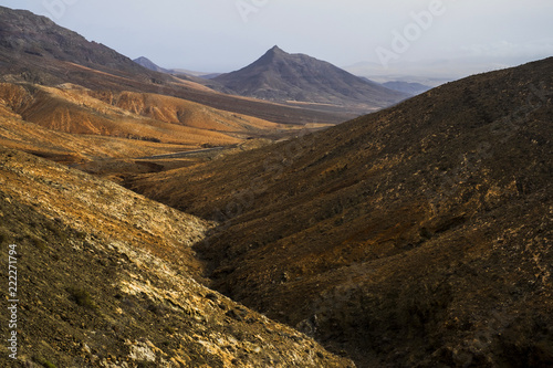 amazing mountains valley panorama in fuerteventura canary island. africa beauty and vulcans land with no huan and nobody. natural landscape timeless perfect to trek and hike. discover the world 
