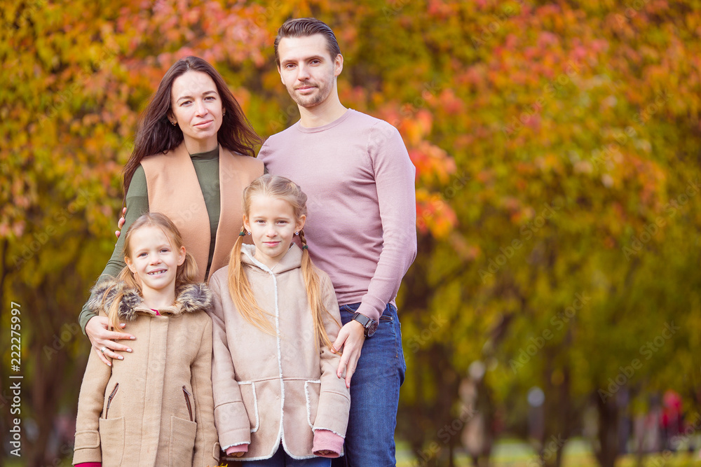 Portrait of happy family of four in autumn day Portrait of happy family of four in autumn day