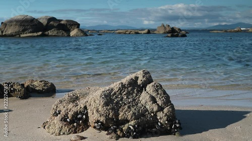 the beautiful beach of mexilloeira on the galician coast of spain on a summer day photo