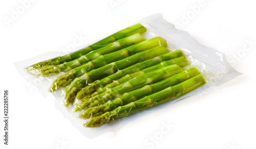 Asparagus vacuum sealed ready for sous vide cooking on white