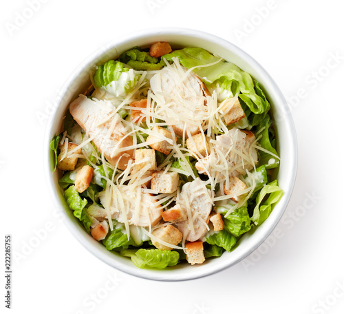 Caesar salad in take away bowl on white background; from above