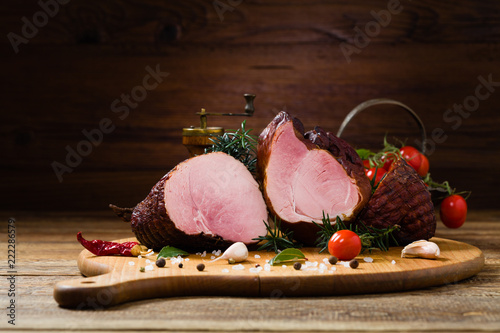 Smoked pork on wooden board.