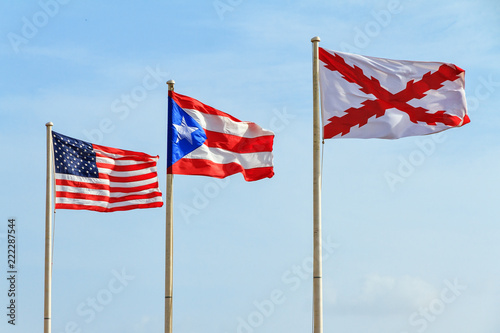Flags of the Old Spanish military (Cross of Burgundy), Puerto Rico and America at fort San Cristobal in San Juan, Puerto Rico photo