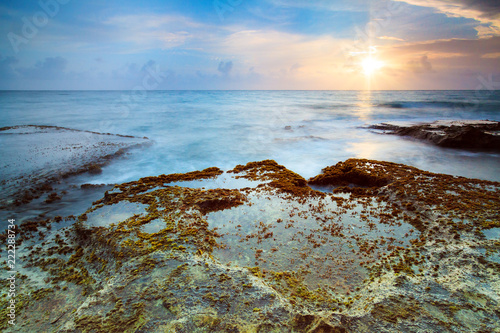 Beautiful sunrise at the rugged pacific coast of tropical island Puerto Rico in the Caribbean