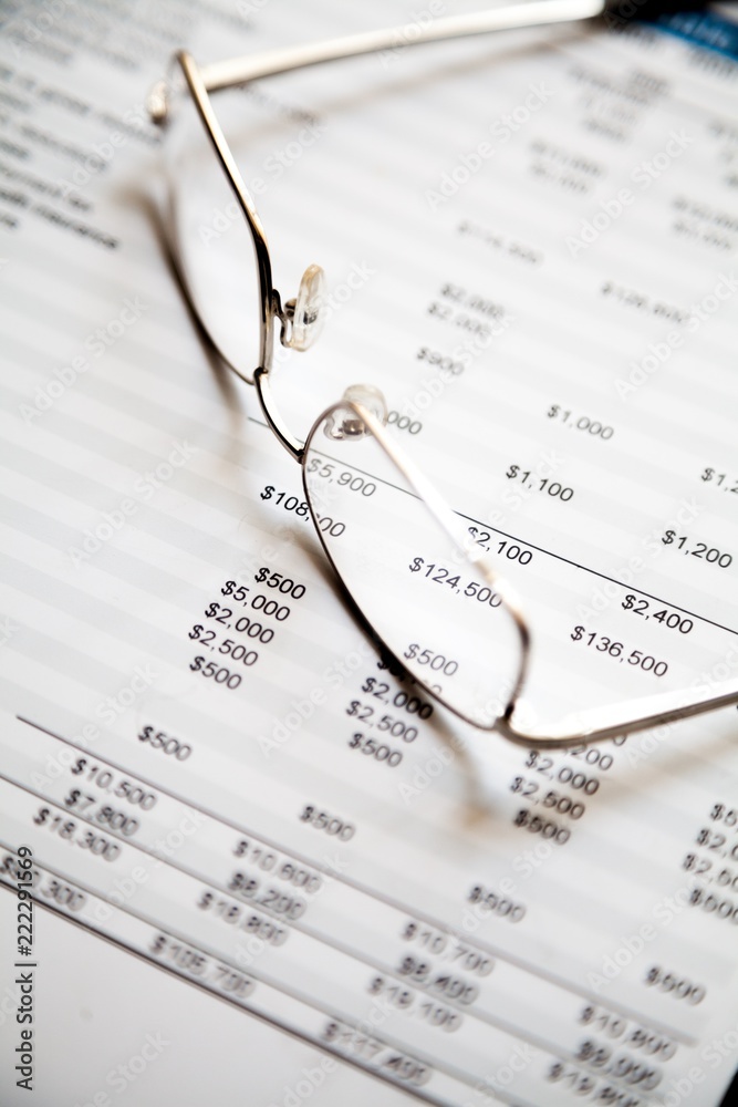 Glasses On Financial Report Close-up Glasses On Financial Report Close-up