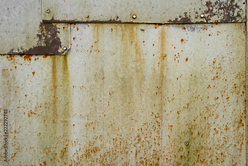 Rusted metal sheets connected by self-tapping screws