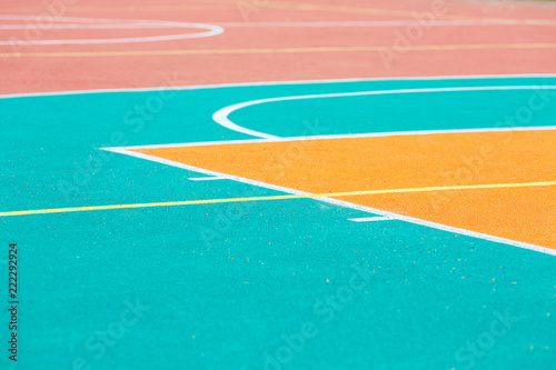 Fragment of an open basketball court with artificial surface.