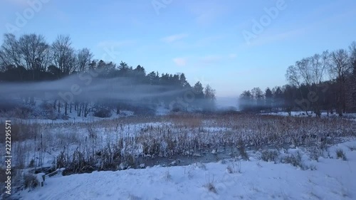 Wallpaper Mural Mist and fog over winter landscape on snowy day. gliding aerial drone view Torontodigital.ca