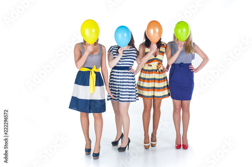A funny young friends holding balloons instead of head. Positive Thinking concepts. hiding some bad feeling