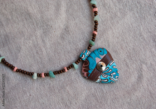 Boho jewelry. Handmade choker from polymer clay in ethno style. Fashion background.