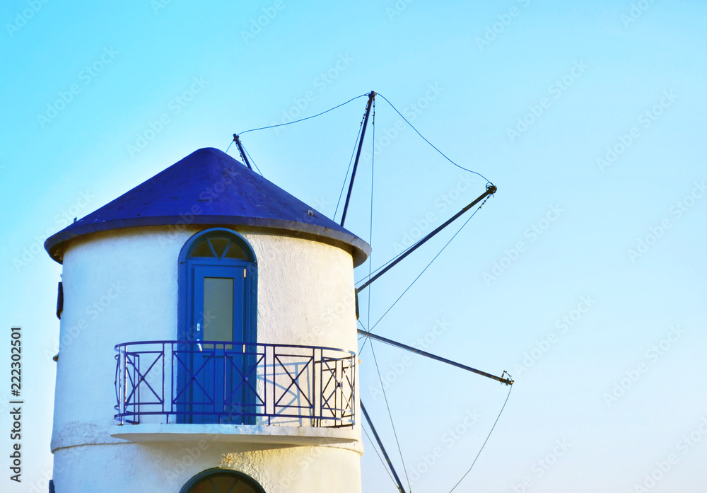 traditional greek windmill - Cyclades Greece - blue sky background