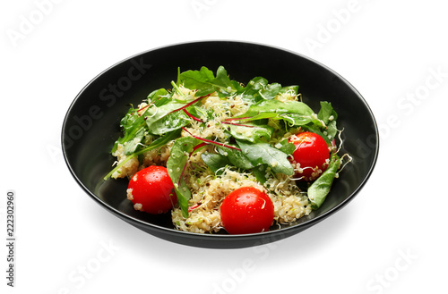 Plate with healthy fresh salad on white background