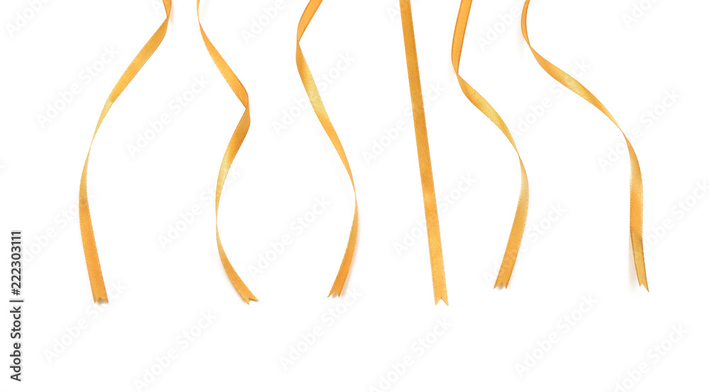 Curly golden ribbons on white background Curly golden ribbons on white background